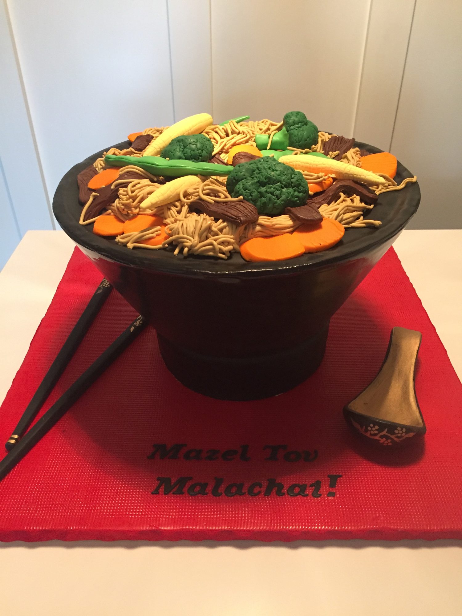 Sculpted bowl of noodles cake with chopsticks